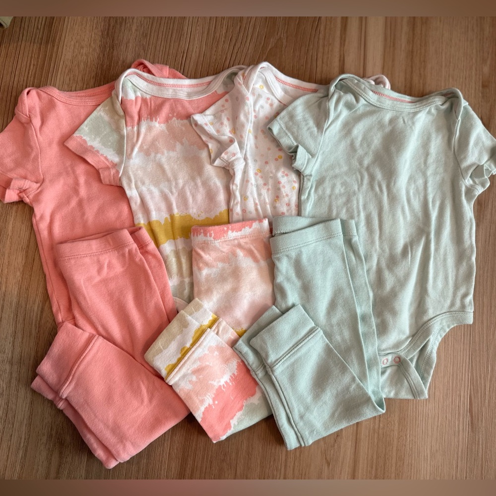 Mix and match baby onesies and pants size 12m
